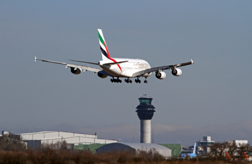Manchester International Airport, England, United Kingdom - March 11, 2014. Emirates Airbus A380 'SuperJumbo' on approach to land.