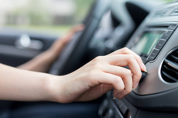 istock asian femle driver touching dashboard in car 479972518