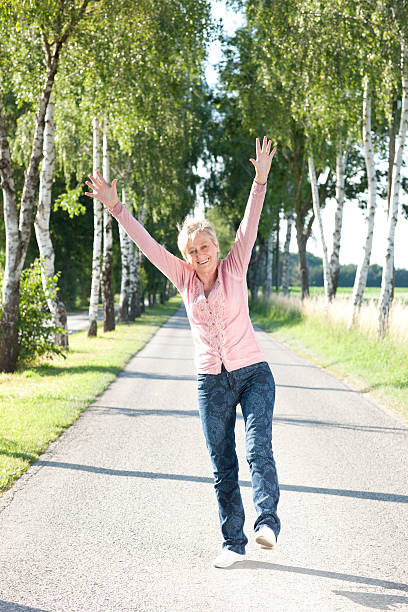 istock Happy senior woman active in nature 479972606