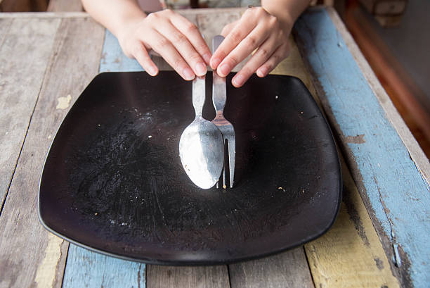 Empty plate after food on wood