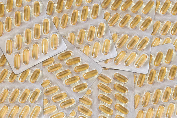 hintergrund von gel kapseln blase-pakete - capsule gel effect pill vitamin pill stock-fotos und bilder