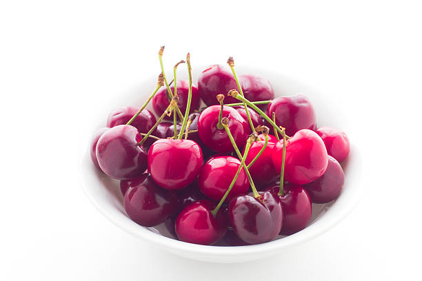 istock Bowl of fresh red cherries on white background 479989642