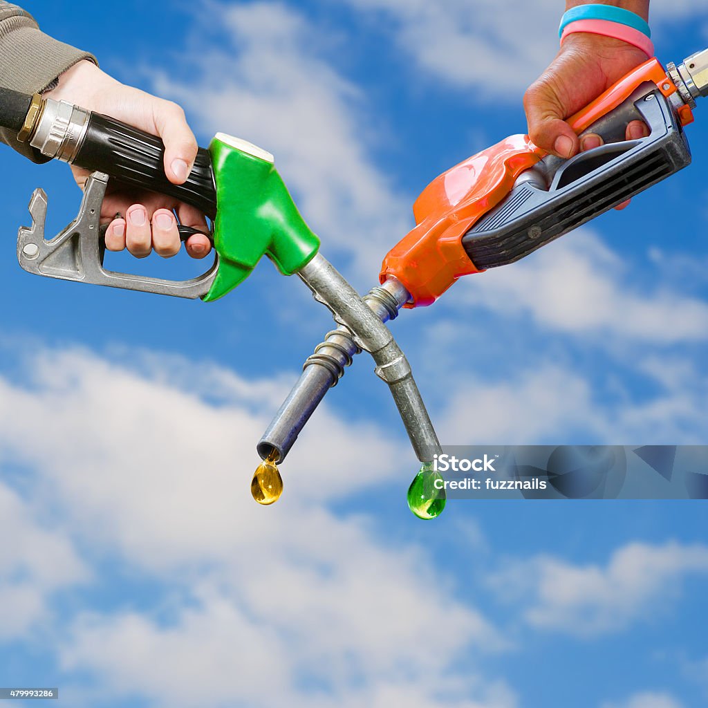 Traditional and ecological fuel competition, photo montage Conflict Stock Photo