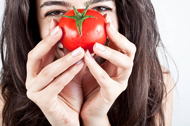 istock Woman showing tomato 479994638
