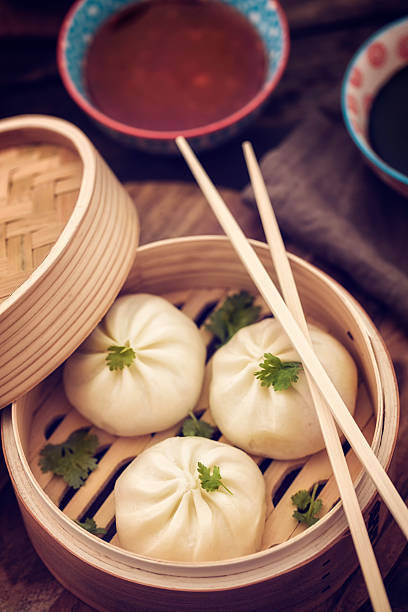 istock Dim Sum Dumplings Freshly Steamed in a Bamboo Steamer 479997034