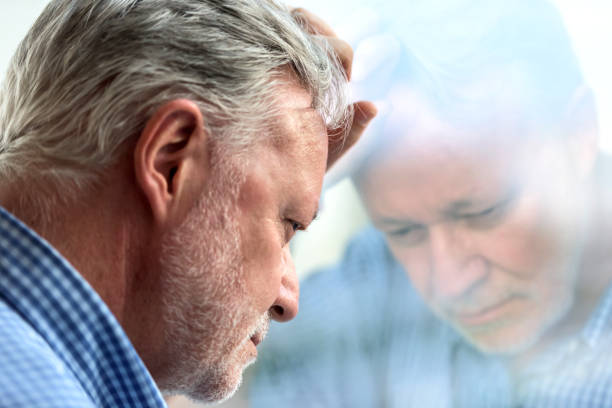 Concerned senior man Serious concerned caucasian senior man posing looking down old man depressed stock pictures, royalty-free photos & images