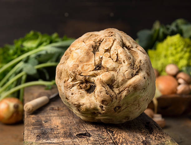 istock Fresh celeriac on rustic wooden background, close up 479998074