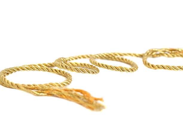 istock Golden rope isolated on white background 479998680