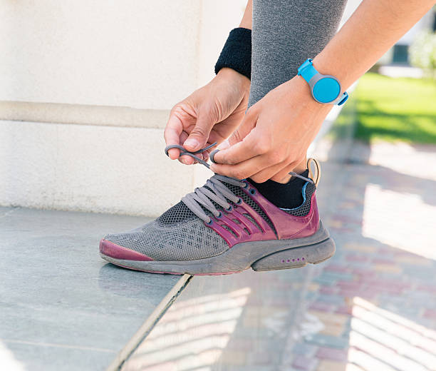 istock Female hands tying shoelaces 479999284