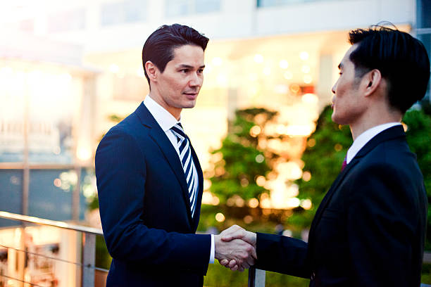 istock Japanese business people warmly greating. 480002900