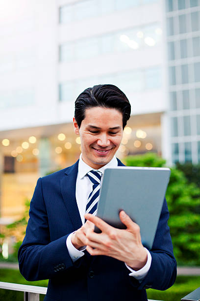 istock Japanese businessman using digital tablet, Tokyo. 480002942