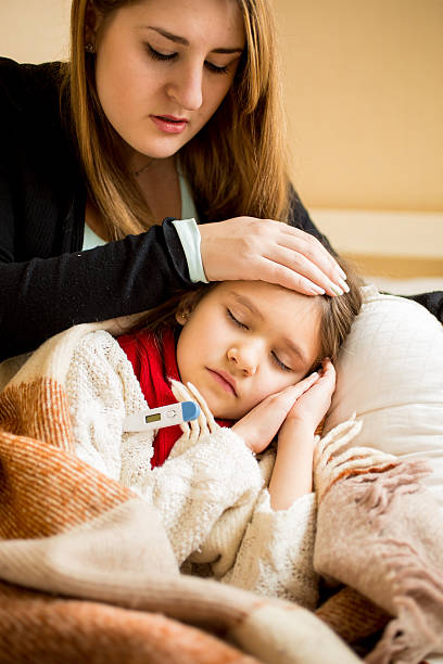 istock young worried mother checking sick daughters temperature 480004540