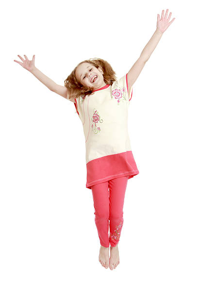 istock Joyful girl jumping with hands wide apart 480005952
