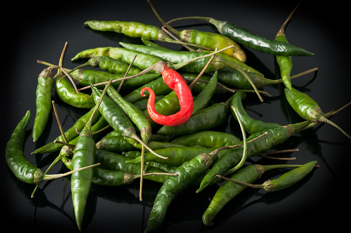 green chili peppers and red