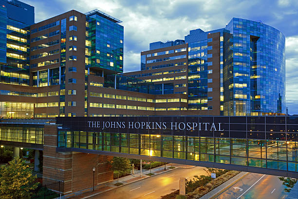 The Johns Hopkins Hospital Baltimore, MD, USA - June 28, 2015: The Johns Hopkins Hospital at night from Orleans Street.  johns stock pictures, royalty-free photos & images