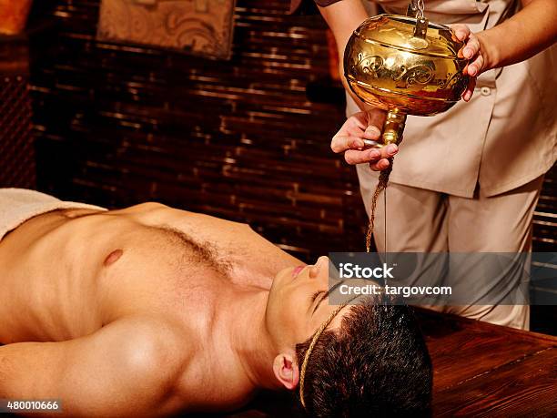 Woman Having Ayurvedic Spa Treatment Stock Photo - Download Image Now - Men, Ayurveda, Alternative Therapy