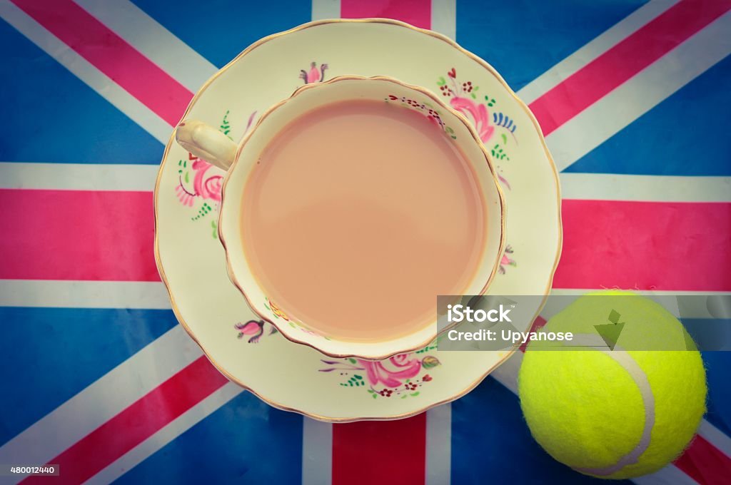 British Tennis A cup of tea and a tennis ball on a union jack flag Tea - Hot Drink Stock Photo