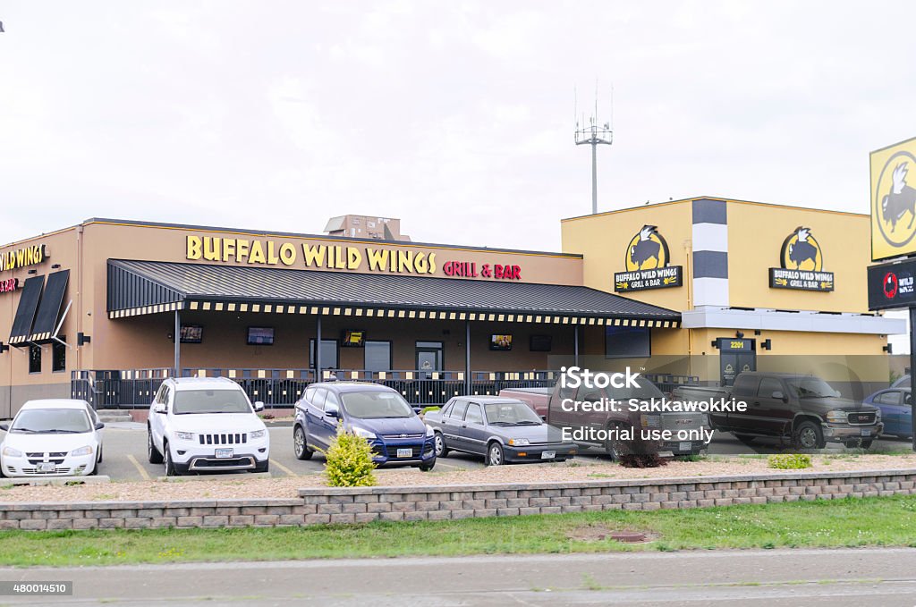 Buffalo Wild Wings Exterior In Minnesota, United States Moorhead, Minnesota, United States - July 6, 2015: Exterior view of Buffalo Wild Wings, a sports bar and restaurant off a road in Moorhead, United States.  Buffalo Wild Wings Stock Photo