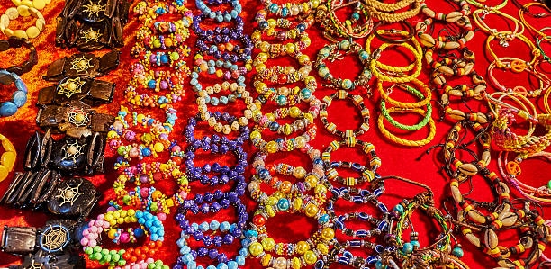 istock Bracelets and other handmade accessories on a bright red surface 480017332