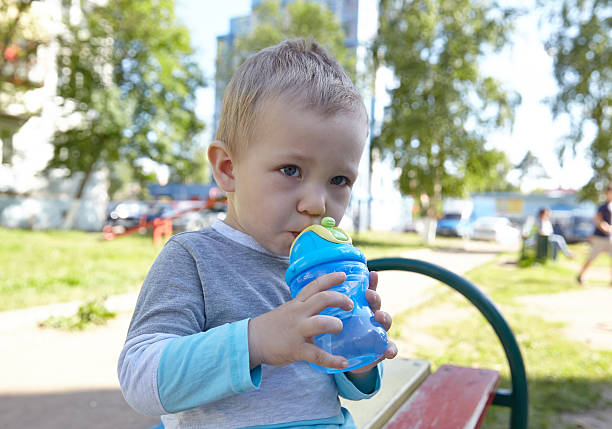 istock Little boy drinking water on a playground 480018684