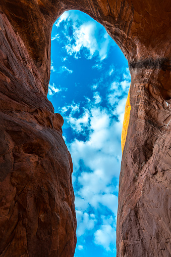 Cave Point Escalante Looking up at the sky from the inside Vertical