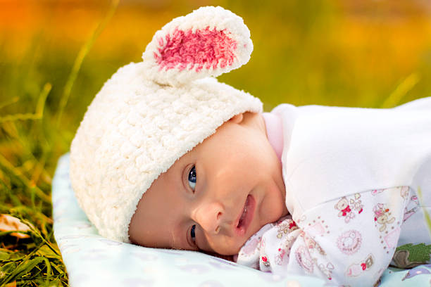 istock The Baby is lying on the green grass 480029330