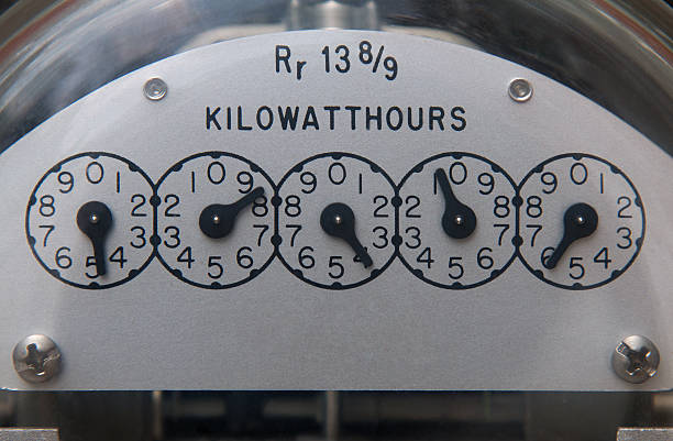 Electric Meter Close up image of an electric meter displaying the kilowatts per hour measurement. kilowatt stock pictures, royalty-free photos & images