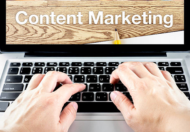 istock hand type on laptop with content Marketing word 480030306