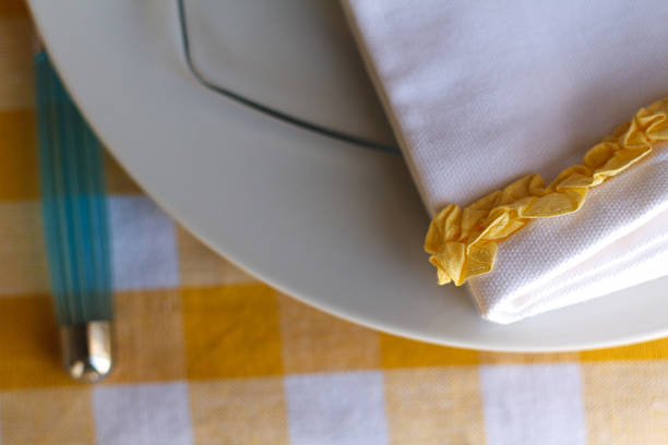 istock Colorful Place Setting, White Napkin, Yellow Ruffle, Blue Fork, Close-Up 480032196