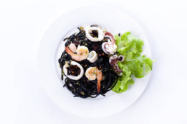 istock Fresh black tagliolini pasta with seafood in herbs 480034464
