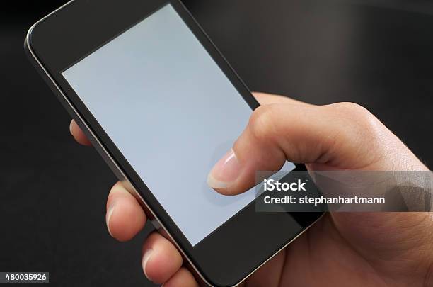 Woman Holds Mobile Phone In One Hand Woman Holding Cellphone Stock Photo - Download Image Now