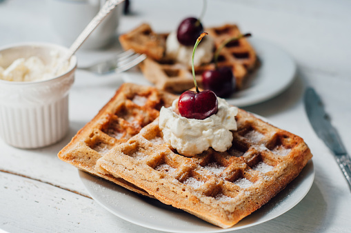 Breakfast with wholegrain brussels waffles and whipped cream