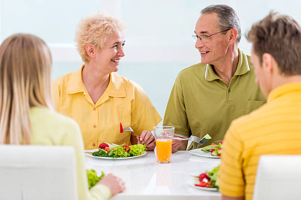 istock Smiling mature couple communicating during lunch. 480039908