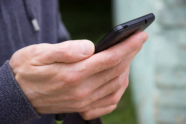 istock Close up of a man using mobile smart phone 480040158