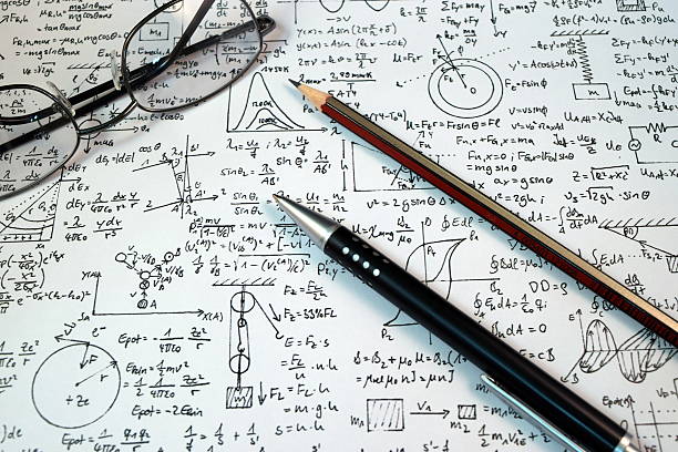 istock Eye Glasses, pen and pencil over the Formula with calculator 480044046
