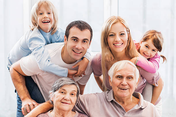 istock Happy extended family at home looking at camera. 480048476