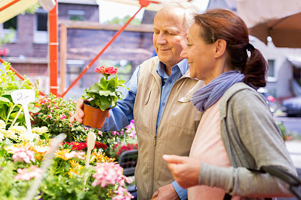 istock Senior man with caregiver shopping 480048874