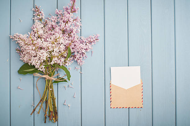 istock vintage postage envelope and summer bouquet of lilac 480051910