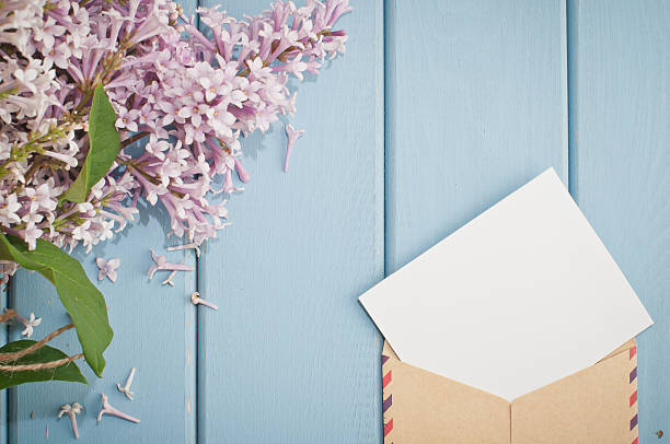 istock vintage postage envelope with card and summer bouquet of lilac 480051958