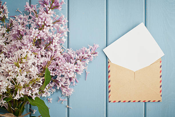 istock vintage postage envelope with card and summer bouquet of lilac 480052054