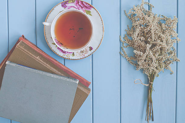 istock tea, books and flowers 480052104