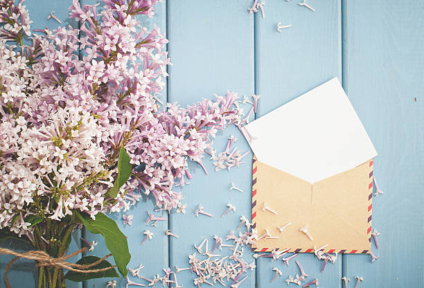 istock vintage postage envelope with card and summer bouquet of lilac 480052132