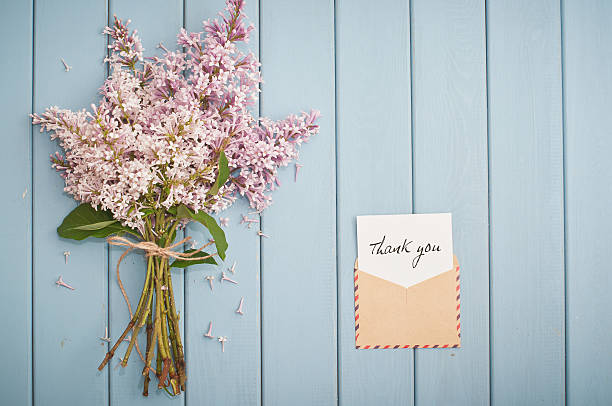 istock vintage postage envelope with card and summer bouquet of lilac 480052154