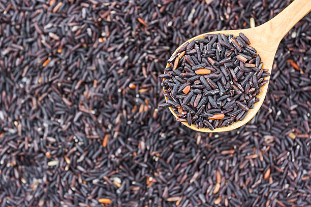 istock Rice berry in a wooden spoon. 480052444