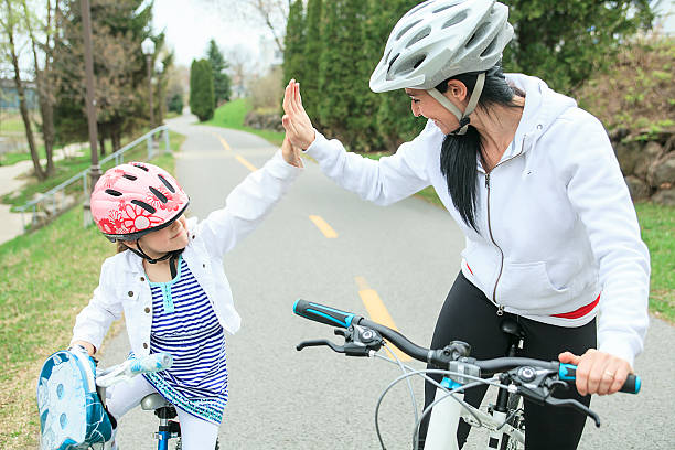 istock Beautiful and happy young on bicycle with her daughter. 480057312