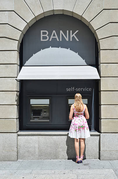 Girl at ATM Girl at ATM 490 stock pictures, royalty-free photos & images