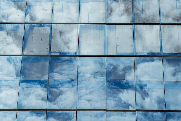 istock Sky reflected in windows of office building 480066740