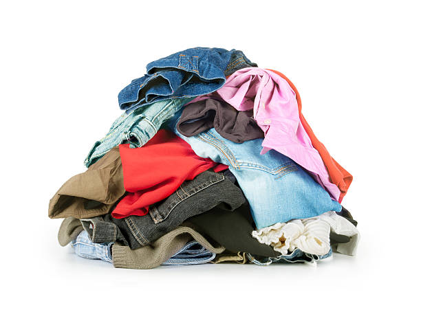stack of clothes stack of clothes isolated on white heap stock pictures, royalty-free photos & images