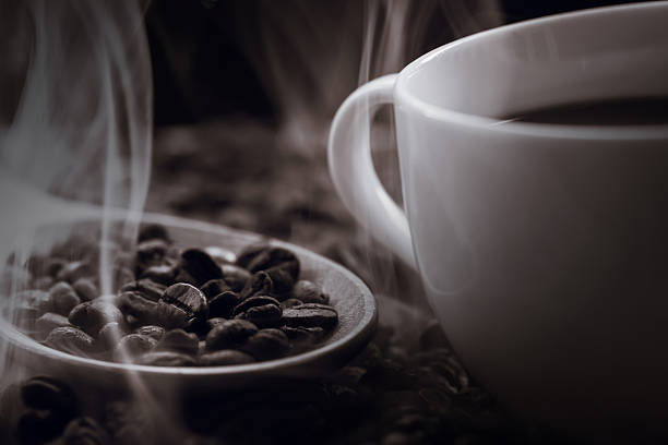 istock close up of fresh coffee beans with smoke 480070928