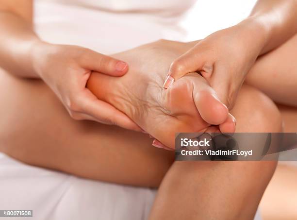 Foot Massaging Stock Photo - Download Image Now - Individuality, Massaging, One Woman Only